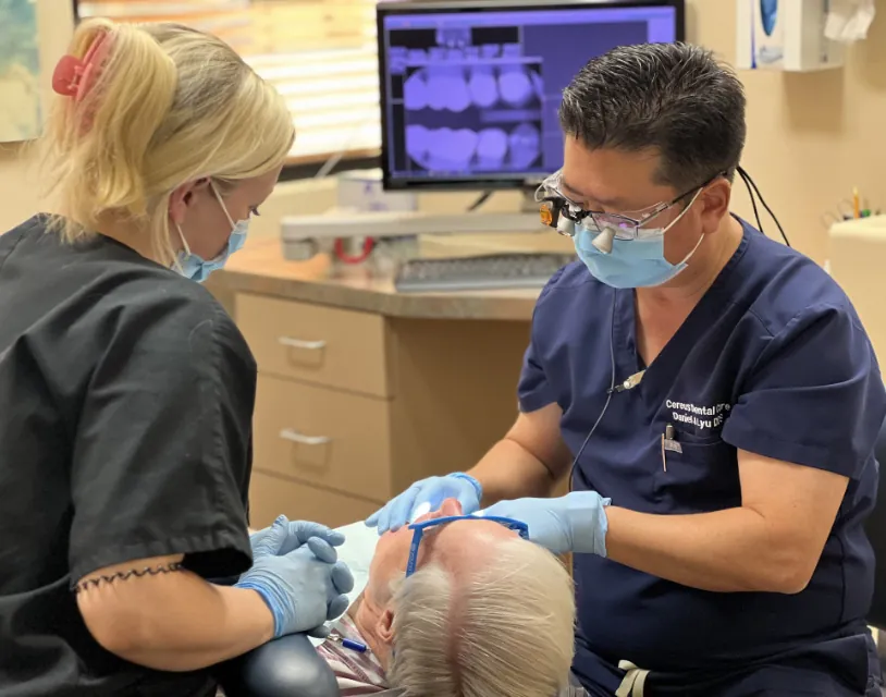 Tempe dentist Dr. Lyu and staff providing dental care to a patient