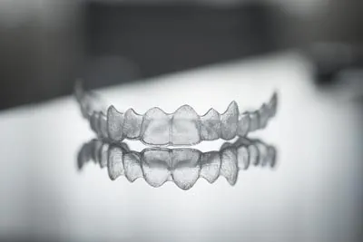 Invisalign clear aligners sitting on a table
