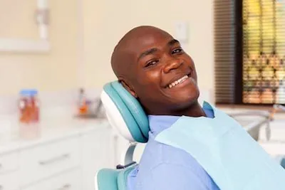 patient sitting in the dental chair during his first visit at Cereus Dental Care