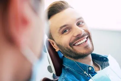 patient smiling during his dental appointment at Cereus Dental Care