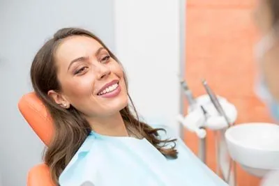 patient smiling after her root canal appointment